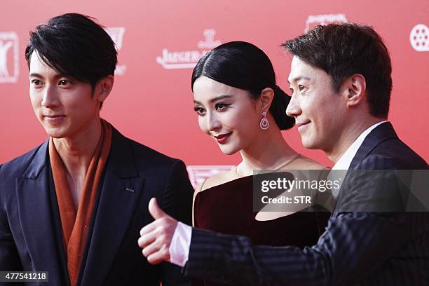 This photo taken on June 13, 2015 shows Taiwanese actor Wu Chun, Chinese actress Fan Bingbing and Hong Kong actor and Cantopop singer Leon Lai...