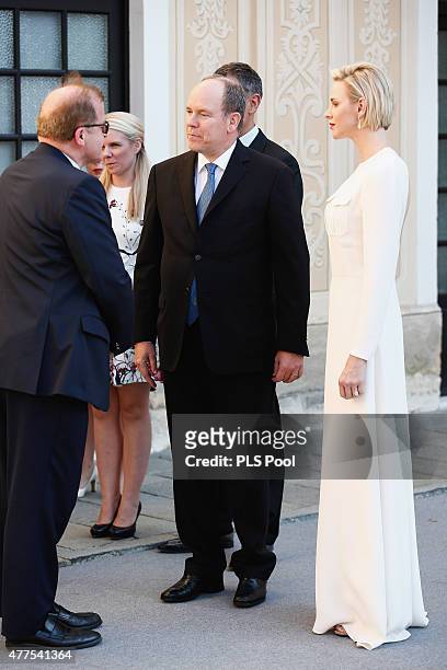 Prince Albert II of Monaco and Princess Charlene of Monaco greet guest during the Monaco Palace cocktail party of the 55th Monte Carlo TV festival on...