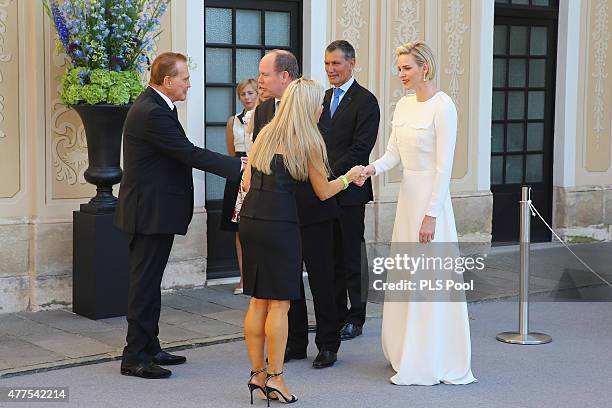 Prince Albert II of Monaco and Princess Charlene of Monaco greet guests during the Monaco Palace cocktail party of the 55th Monte Carlo TV festival...