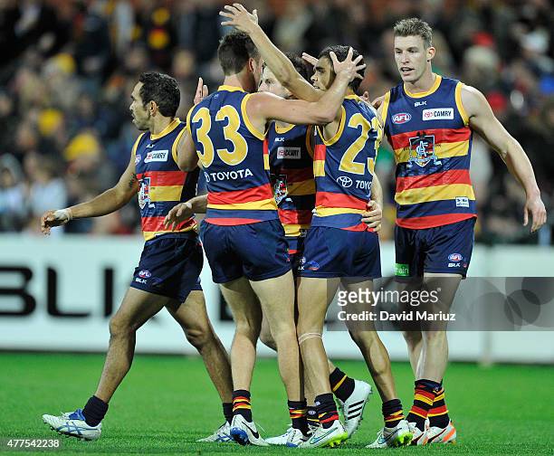 Charlie Cameron of the Crows celebrates his goal with team-mates during the round 12 AFL match between the Adelaide Crows and the Hawthorn Hawks at...
