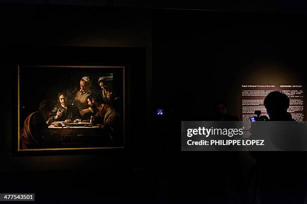 Cameraman films Italian Baroque master Michelangelo Merisi da Caravaggio's most important works, Supper at Emmaus, during a media preview after its...