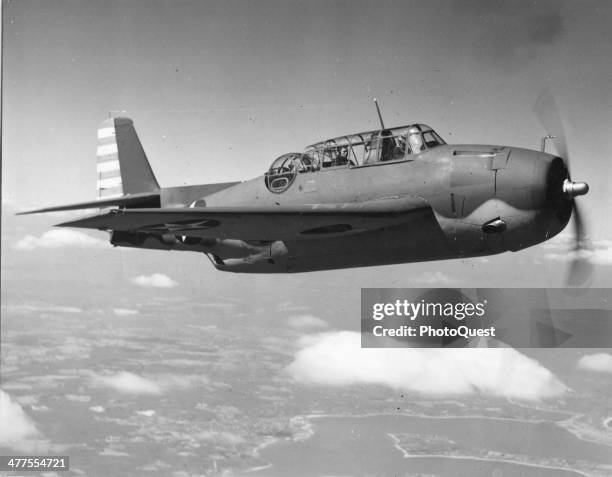 View of a US Navy Grumman Avenger torpedo bomber in flight, 1943.