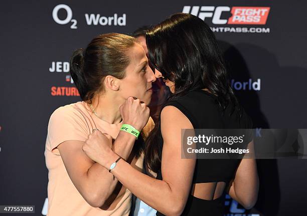 Opponents Joanna Jedrzejczyk of Poland and Jessica Penne of the United States face off during the UFC Berlin Ultimate Media Day at the O2 World on...