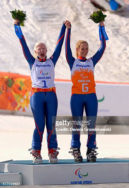 Gold medallists Kelly Gallagher of Great Britain and guide Charlotte Evans during the flower ceremony for the Women's Super-G - Visually Impaired...