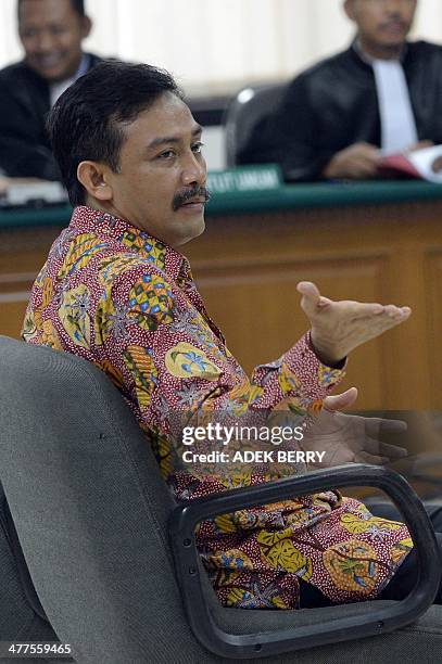 Former Youth and Sports Minister Andi Mallarangeng gestures during his trial at the corruption court in Jakarta on March 10, 2014. Mallarangeng faced...