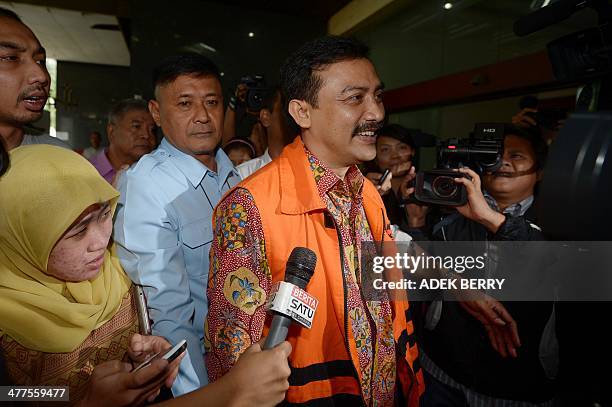 Former Youth and Sport minister Andi Mallarangeng arrives at the corruption court in Jakarta on March 10, 2014. Mallarangeng faced the court over...
