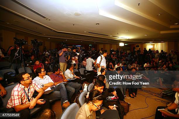 Members of the media wait before a press conference on the latest updates of missing Malaysia Airlines flight MH370 on March 10, 2014 in Kuala...