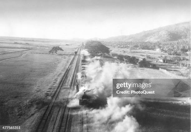 This picture shows the result of an RAF Beaufighter attack on a Japanese train south of Mandalay on the main railroad to Rangoon, Burma, December...