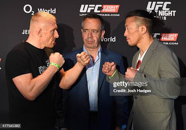 Opponents Dennis Siver of Germany and Tatsuya Kawajiri of Japan face off during the UFC Berlin Ultimate Media Day at the O2 World on June 18, 2015 in...