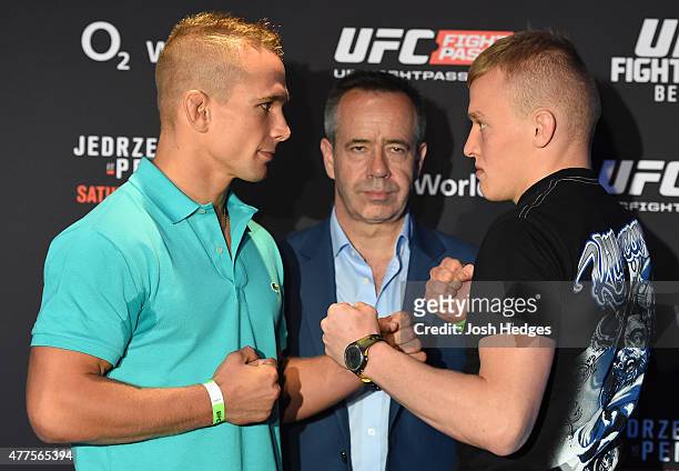 Opponents Nick Hein of Germany and Lukasz Sajewski of Poland face off during the UFC Berlin Ultimate Media Day at the O2 World on June 18, 2015 in...