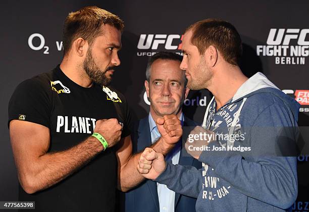 Opponents Peter Sobotta of Germany and Steve Kennedy of Australia face off during the UFC Berlin Ultimate Media Day at the O2 World on June 18, 2015...