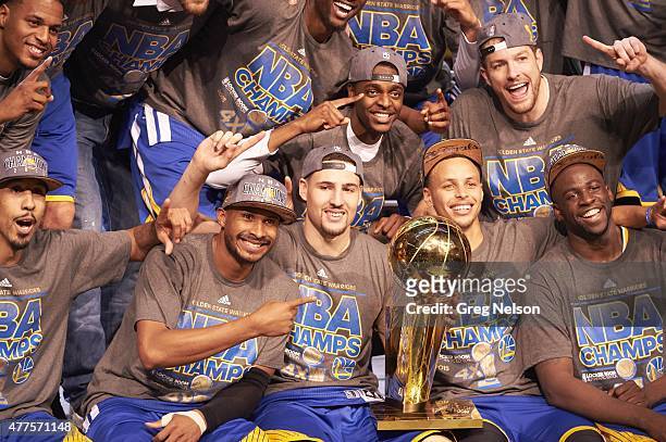 Finals: Golden State Warriors players victorious with Larry O'Brien Trophy after winning Game 6 and championship series vs Cleveland Cavaliers at...