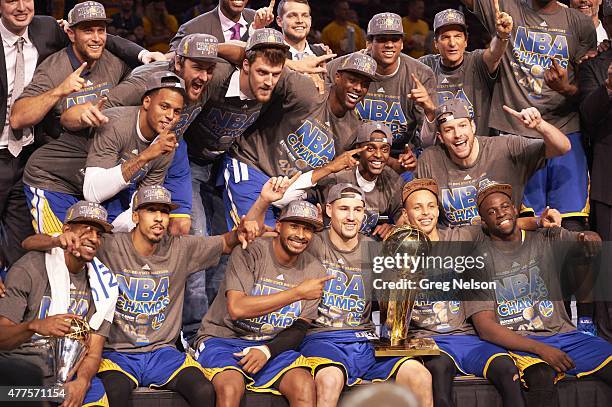 Finals: Golden State Warriors players victorious with Larry O'Brien Trophy after winning Game 6 and championship series vs Cleveland Cavaliers at...