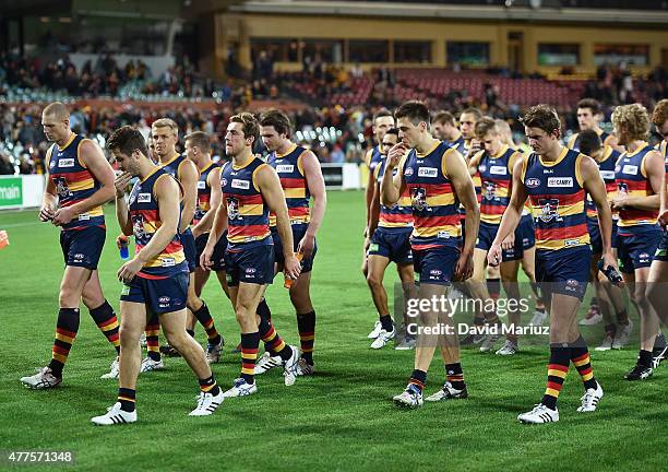 Crows players leave the ground after their loss in the round 12 AFL match between the Adelaide Crows and the Hawthorn Hawks at Adelaide Oval on June...