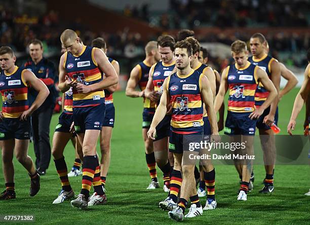 Crows players leave the ground after their loss in the round 12 AFL match between the Adelaide Crows and the Hawthorn Hawks at Adelaide Oval on June...