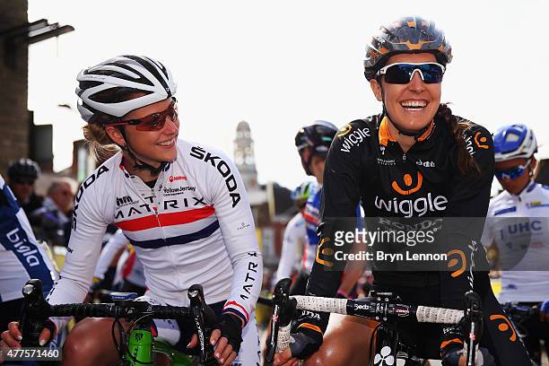 Laura Trott of Great Britain and Matrix Fitness shares a joke with Dani King of Great Britain and Wiggle Honda as they wait for the start of stage...