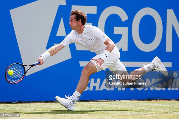 Andy Murray of Great Britain stretches to play a forehand in his men's singles second round match against Fernando Verdasco of Spain during day four...