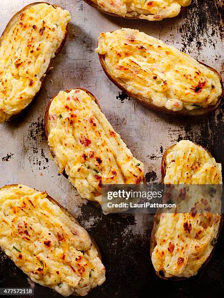 twice baked, stuffed potatoes with cheese and bacon - stuffed potato stock pictures, royalty-free photos & images