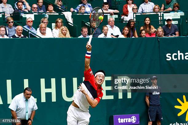 Kei Nishikori of Japan plays a forehand in his match against Dustin Brown of Germany during day four of the Gerry Weber Open at Gerry Weber Stadium...