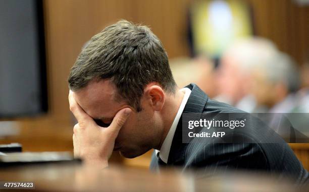 Olympic and Paralympic track star Oscar Pistorius is pictured during a hearing on the sixth day of his trial for the 2013 murder of his girlfriend,...