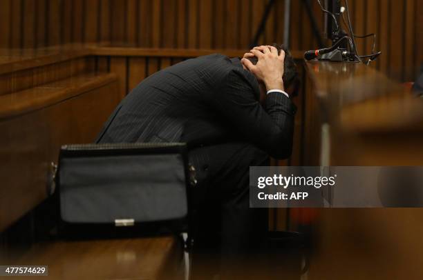Olympic and Paralympic track star Oscar Pistorius is pictured during a hearing on the sixth day of his trial for the 2013 murder of his girlfriend,...