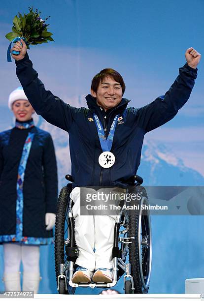 Silver medalist Taiki Morii of Japan celebrates after winning the Men's Super G Sitting Skiing during the Sochi 2014 Paralympic Games on March 9,...