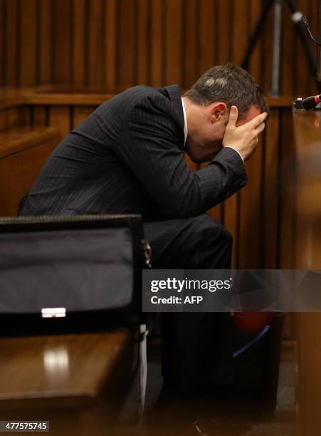 Olympic and Paralympic track star Oscar Pistorius vomits during a hearing on the sixth day of his trial for the 2013 murder of his girlfriend, on...