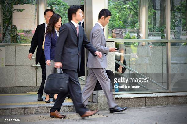 commuters exiting subway system in tokyo - japanese exit sign stock pictures, royalty-free photos & images