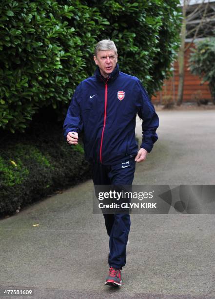 Arsenal's French manager Arsene Wenger attends a training session at Arsenal's training ground at London Colney, north of London, on March 10 one day...