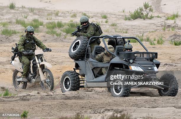 Lithuanian soldiers take part in a NATO Response Force exercise in Zagan, southwest Poland on June 18, 2015. AFP PHOTO / JANEK SKARZYNSKI