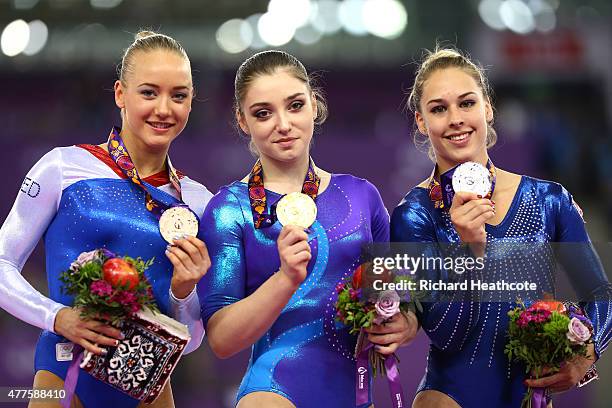 Bronze medalist Lieke Wevers of Netherlands, gold medalist Aliya Mustafina of Russia and Silver medalist Giulia Steingruber of Switzerland pose with...