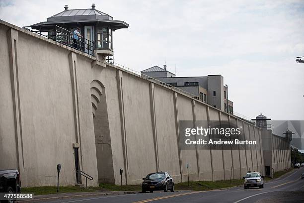 Cars drive past Clinton Correctional Facility on June 18, 2015 in Dannemora, New York. After conducting a manhunt across approximately 10,000 acres...