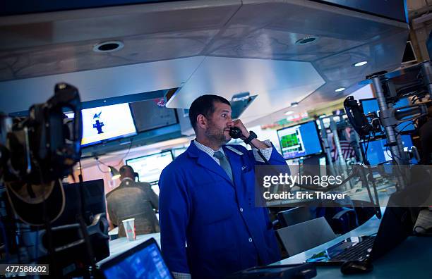 Traders work the floor of the New York Stock Exchange during the IPO debut of the company Fitbit on June 18, 2015 in New York City. Fitbit Inc....