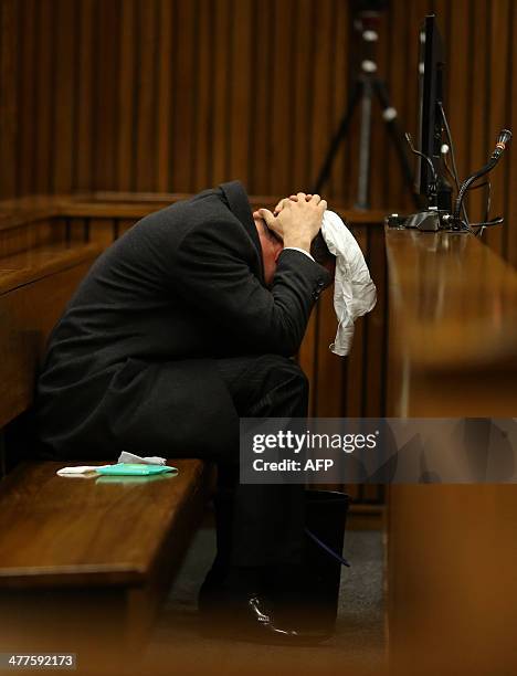 Olympic and Paralympic track star Oscar Pistorius reacts during a hearing on the sixth day of his trial for the 2013 murder of his girlfriend, on...