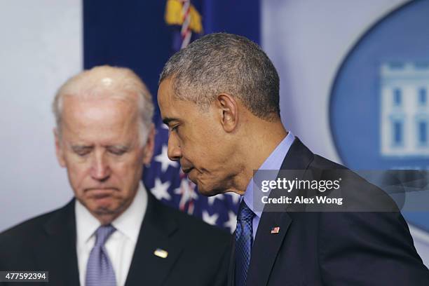 President Barack Obama, flanked by Vice President Joe Biden, leaves after making a statement regarding the shooting in Charleston, South Carolina,...