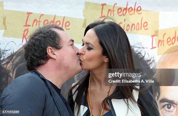 Producer Maria Grazia Cucinotta and husband Giulio Violati attend 'Maldamore' photocall at Villa Borghese on March 10, 2014 in Rome, Italy.