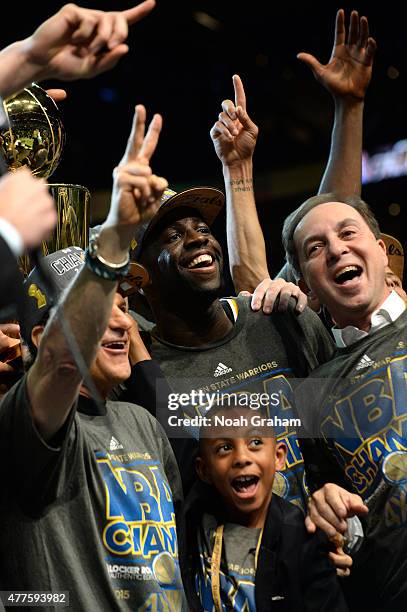 Joe Lacob, Draymond Green, and Peter Guber of the Golden State Warriors celebrate winning the 2015 NBA Finals against the Cleveland Cavaliers during...
