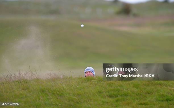 Alejandro Tosti of Argentina plays out of a bunker on the 16th during The Amateur Championship 2015 - Day Four at Carnoustie Golf Club on June 18,...