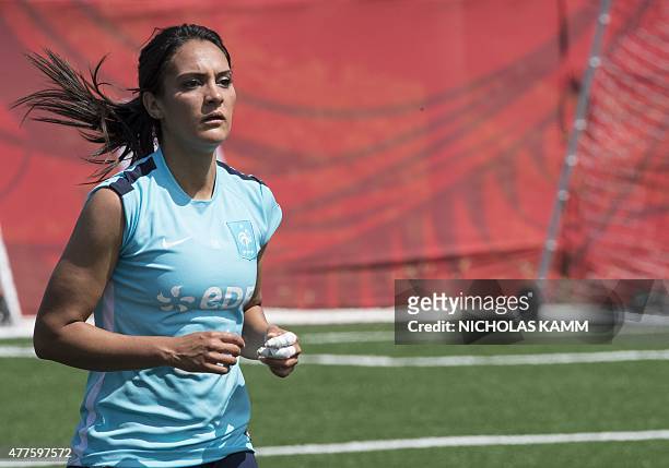 France's Louisa Necib jogs during a training session in Ottawa on June 18, 2015 three days before France's Round of 16 2015 FIFA Women's World Cup...