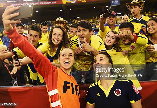 Stefany Castano and Nataly Arias of Colombia makes a selfie with fans after the FIFA Womens's World Cup Group F match between England and Colombia at...