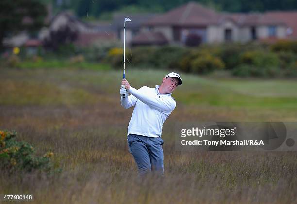 Robert MacIntyre of Glencruitten plays his second shot on the 12th fairway during The Amateur Championship 2015 - Day Four at Carnoustie Golf Club on...