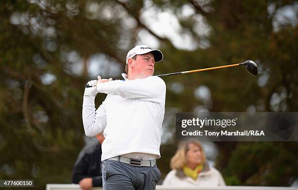 Robert MacIntyre of Glencruitten plays his first shot on the 14th tee during The Amateur Championship 2015 - Day Four at Carnoustie Golf Club on June...