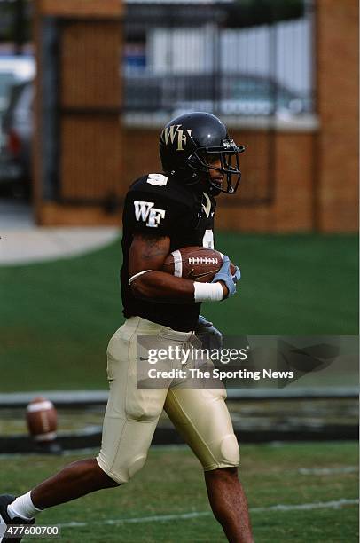 Eric King of the Wake Forest Demon Deacons runs with the ball against the North Carolina Tar Heels on October 26, 2002.