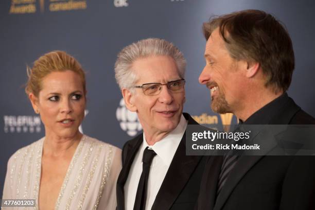David Cronenberg is framed by Maria Bello and Viggo Mortenson Red Carpet arrivals for the Canadian Screen Awards handed out at the Sony Centre for...