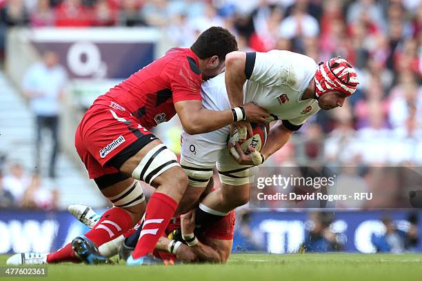 Ben Morgan of England is tackled by Toby Faletau of Wales during the RBS Six Nations match between England and Wales at Twickenham Stadium on March...