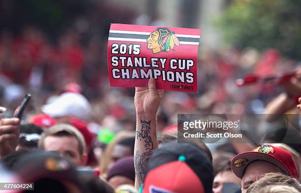 Fans wait for the start of a parade to celebrate the Chicago Blackhawks' winning of the Stanley Cup on June 18, 2015 in Chicago, Illinois. On Monday...