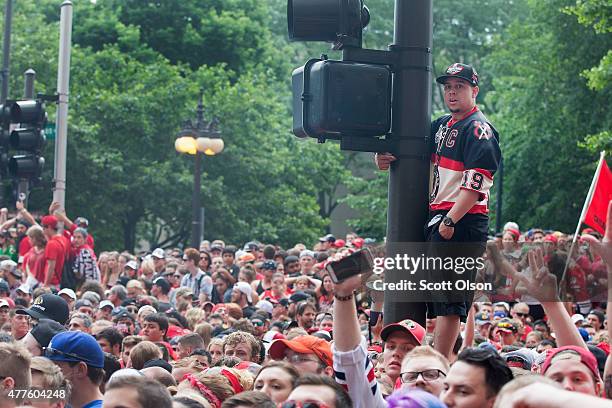 Fans wait for the start of a parade to celebrate the Chicago Blackhawks' winning of the Stanley Cup on June 18, 2015 in Chicago, Illinois. On Monday...