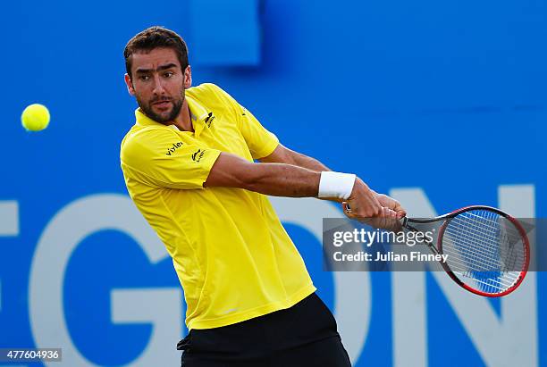 Marin Cilic of Croatia plays a backhand in his men's singles second round match against Viktor Troicki of Serbia during day four of the Aegon...