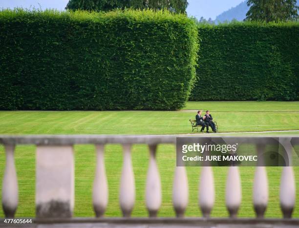 Slovenian Prime Minister Miro Cerar and British Prime Minister David Cameron sit on a bench at Brdo Castle, some 25 km north of Ljubljana, Slovenia,...