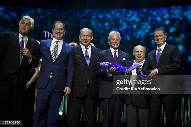 Jay Leno, Stan Polovets, Israeli PM Benjamin Netanyahu, Michael Douglas, Netan Sheransky and Uli Edelshtean seen with the Genesis Prize during the...